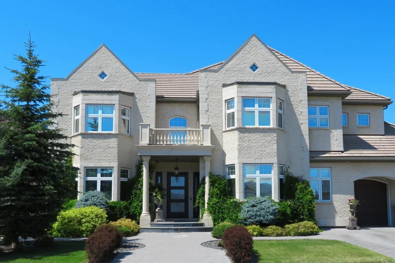 A grand entrance of a luxury home with double doors, representing off-market luxury homes for sale
