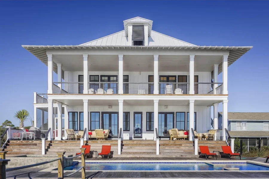 Luxury home exterior with manicured lawn and fountain